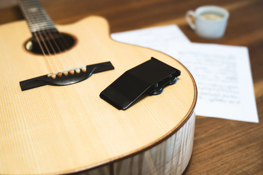 Gitano 70900 guitar support, black and aluminium – folded on a guitar