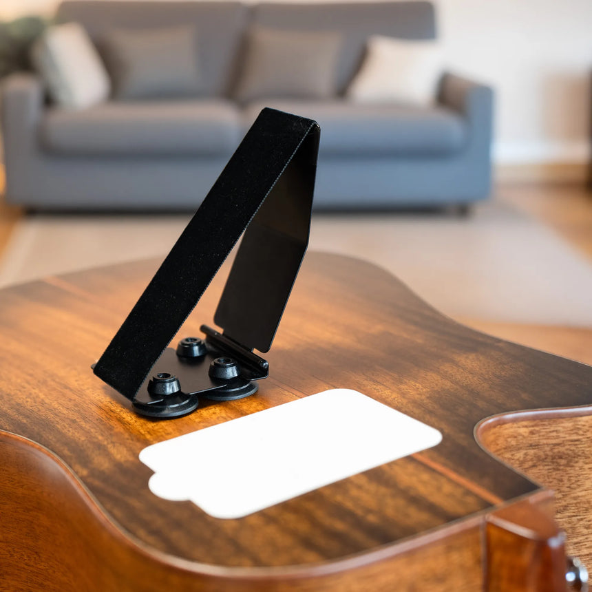 Gitano 70900 guitar support, black and aluminium – unfolded on a guitar with visible suction cups